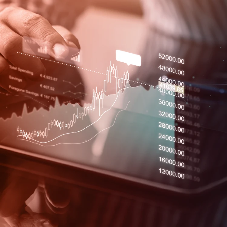 Touch interaction on a tablet displaying financial charts and business metrics, highlighting advanced data and technology enablement solutions.